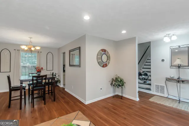 a view of a livingroom with furniture and hardwood floor