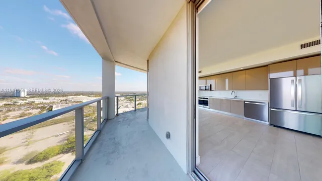a view of a kitchen with a sink and an oven