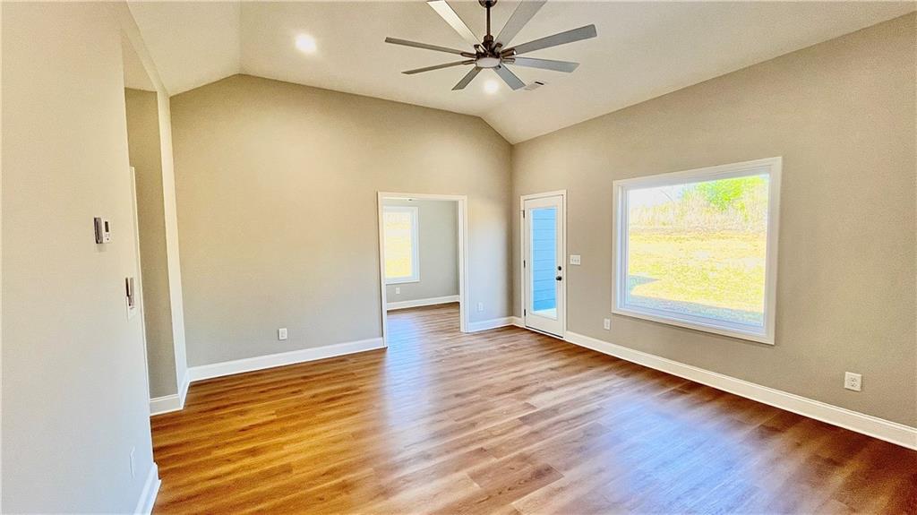 23 S Road Griffin, GA 30224 - Photo 29 of 32 a view of an empty room with window and wooden floor