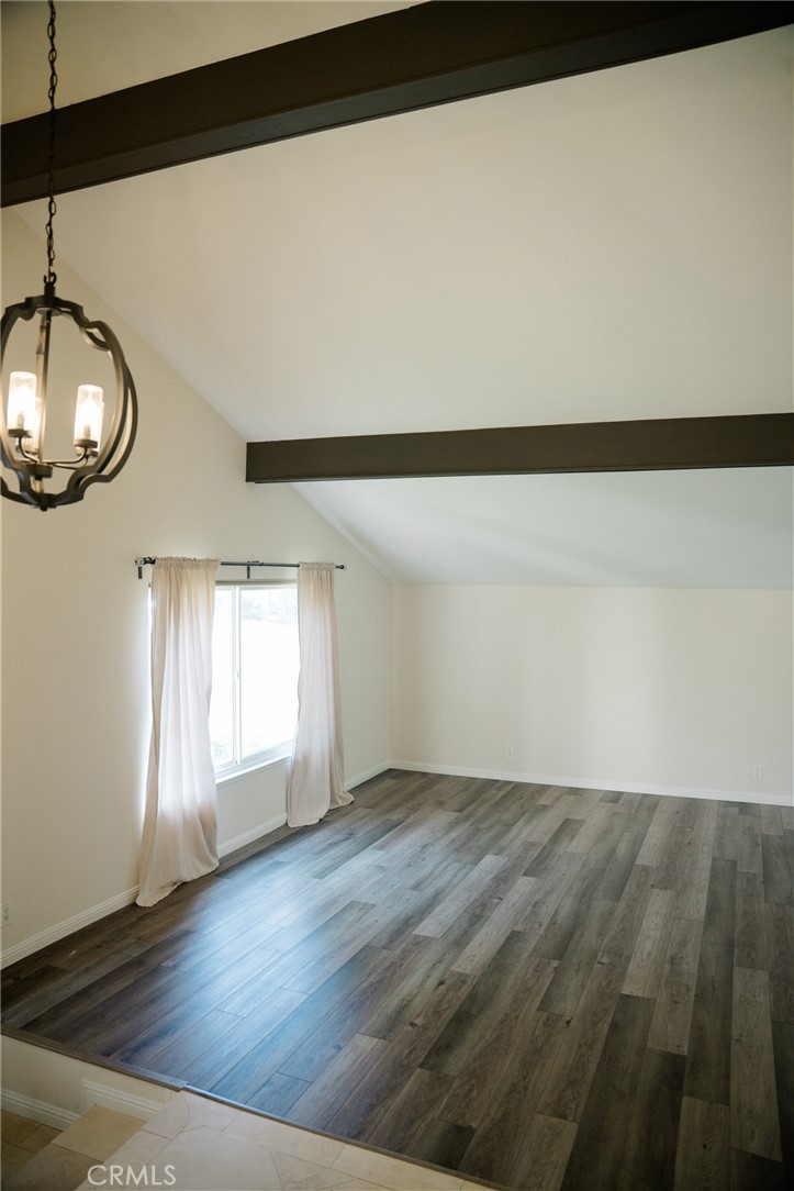 23035 Cecelia Mission Viejo, CA 92691 - Photo 12 of 30 a view of an empty room with wooden floor and fan