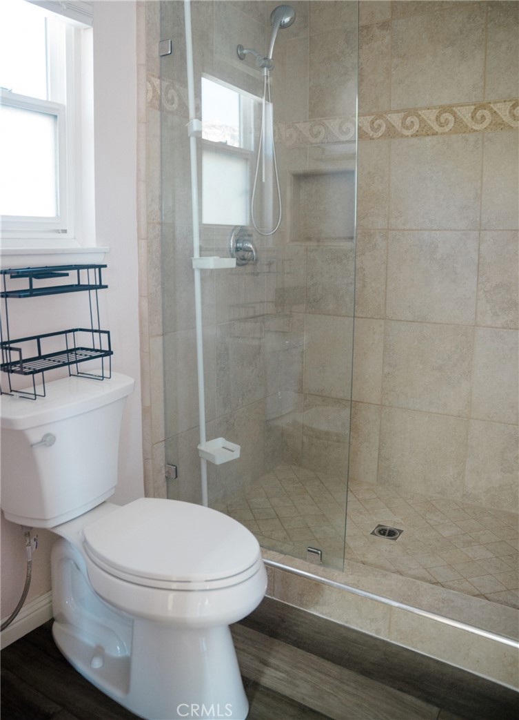 23035 Cecelia Mission Viejo, CA 92691 - Photo 23 of 30 a bathroom with a toilet and a shower