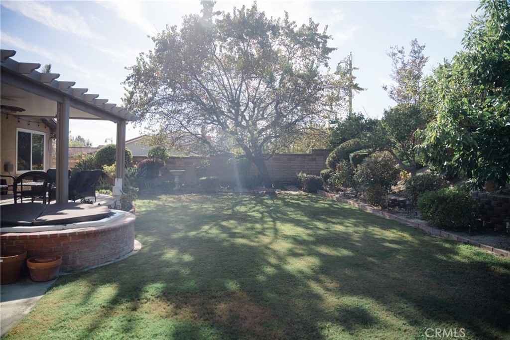 23035 Cecelia Mission Viejo, CA 92691 - Photo 4 of 30 a backyard of a house with fountain table and chairs