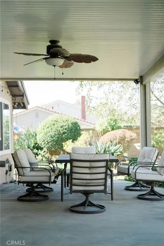 a living room with a couch and floor to ceiling window