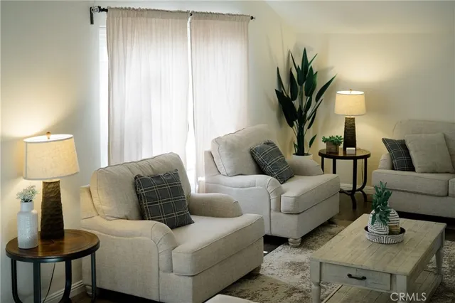 a living room with furniture and a lamp