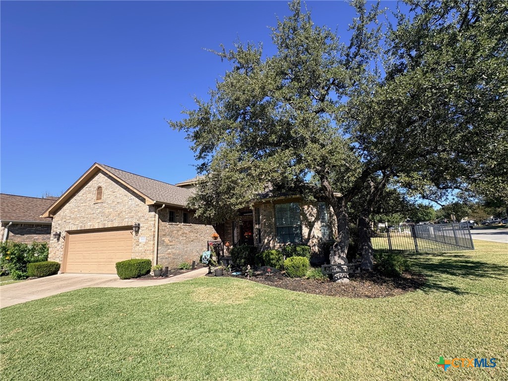 4802 Hidden Springs Trail Georgetown, TX 78633 - Photo 3 of 8 a front view of a house with a yard and garage