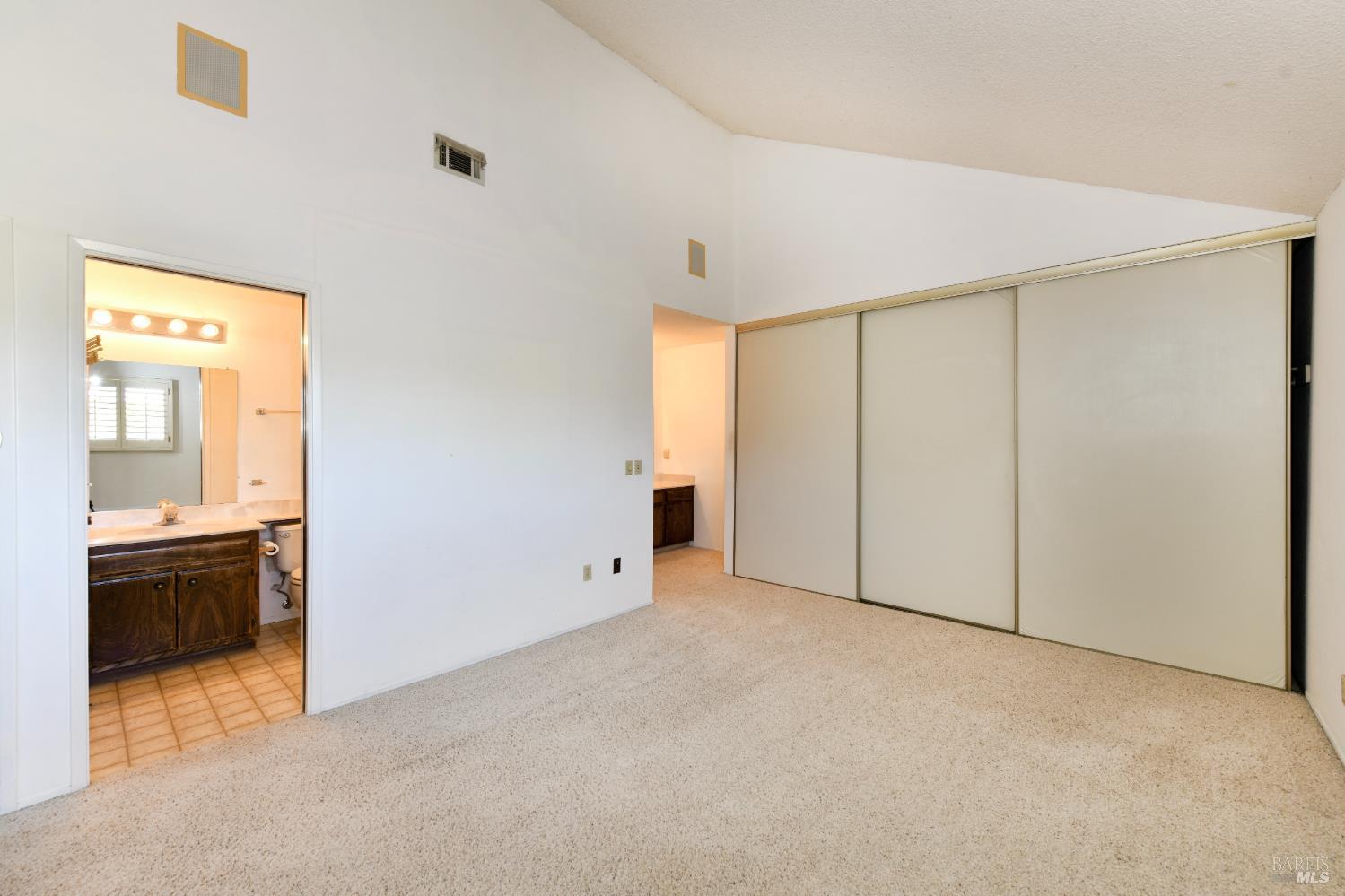 3007 Loma Court Santa Rosa, CA 95405 - Photo 24 of 43 Primary bathroom has two sink areas. One located in the bedroom, the second with a pocket door. Large closets, plus additional linen closet - bath supplies.