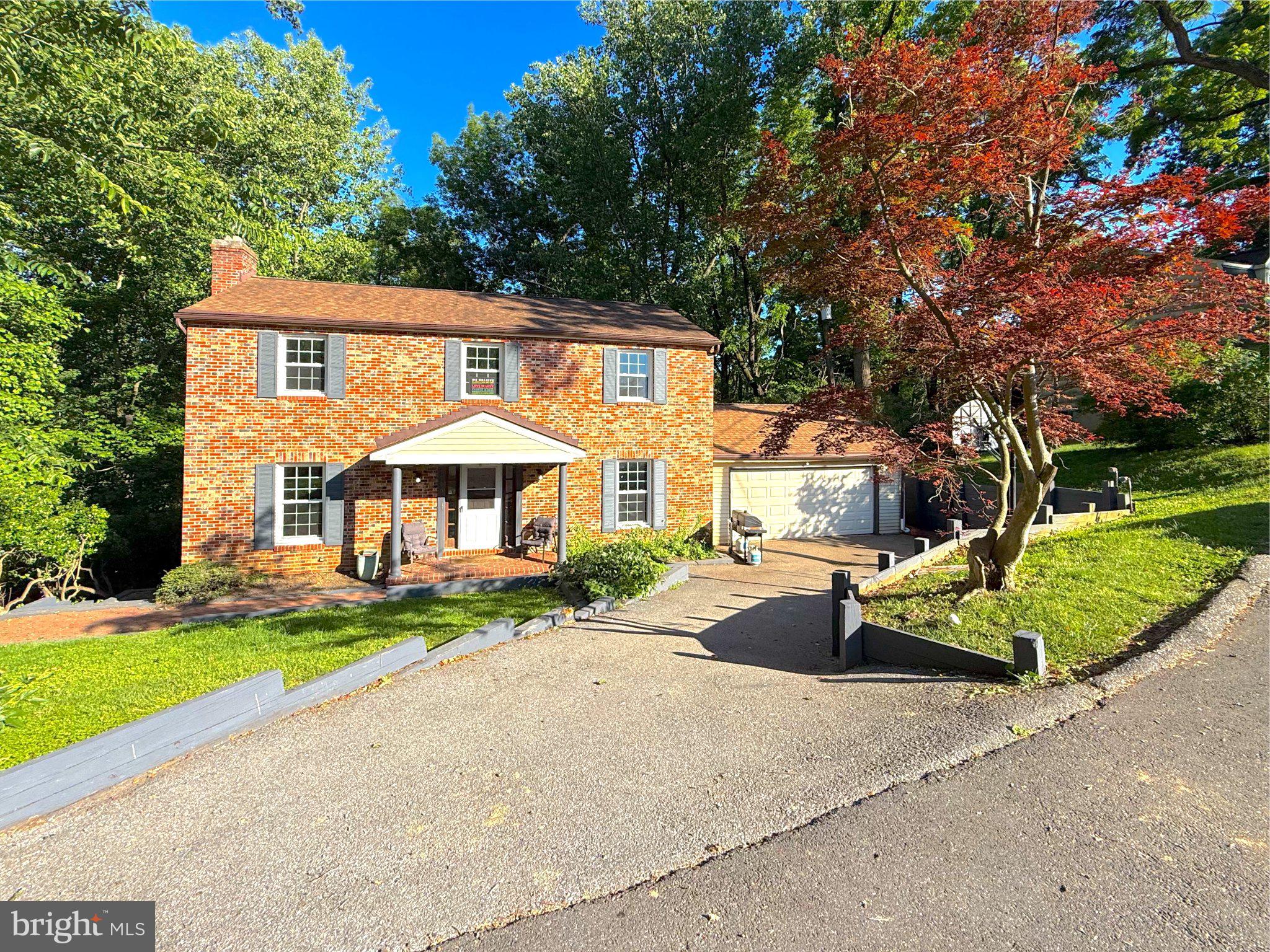 9006 Sidehill Road Ellicott City, MD 21042 - Photo 2 of 53 Charming brick home in lush surroundings.