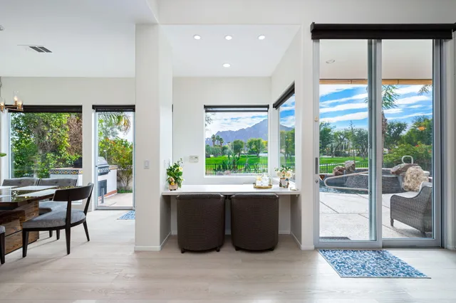 a living room with large windows