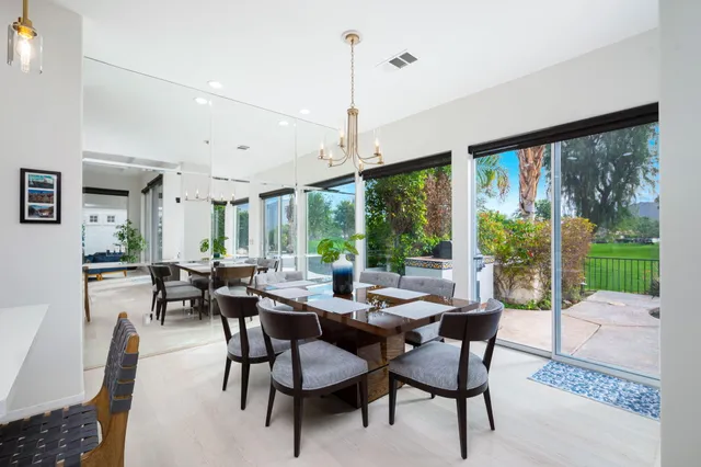 a view of a dining room with furniture window and outside view