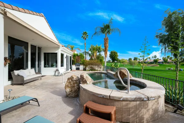 a view of a swimming pool with a patio