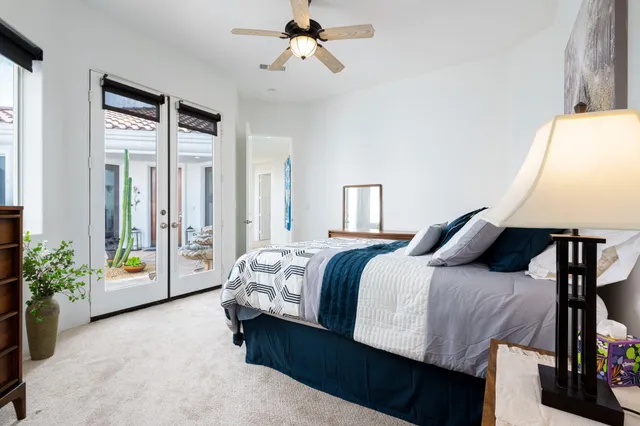 a bed room with a bed and a window