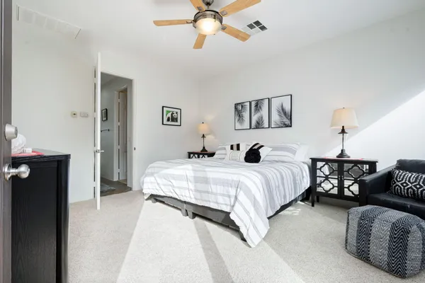 a bedroom with bed and window