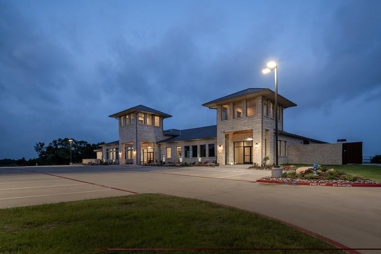 2715 Triumph Court Heath, TX 75126 - Photo 23 of 30 a front view of a building with yard