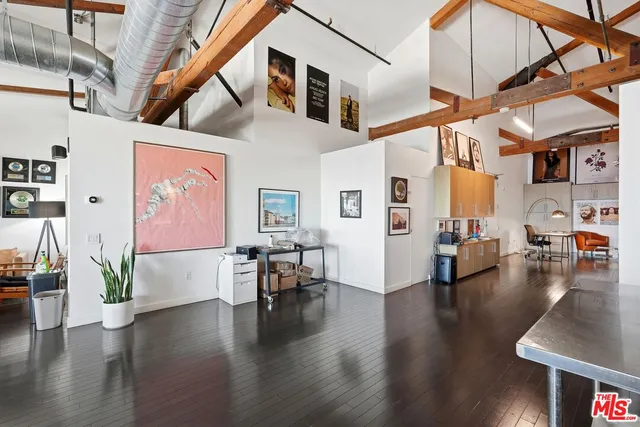 a dining room with lots of furniture and wooden floor