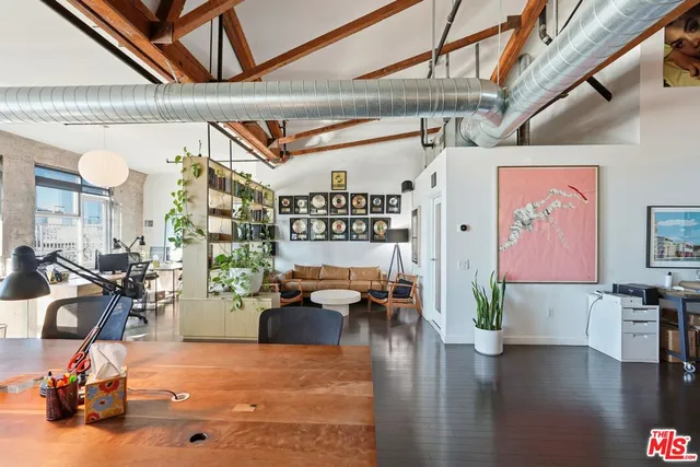 a very nice looking living room with furniture and wooden floor