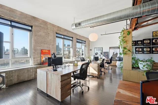 a living room with furniture and a book shelf