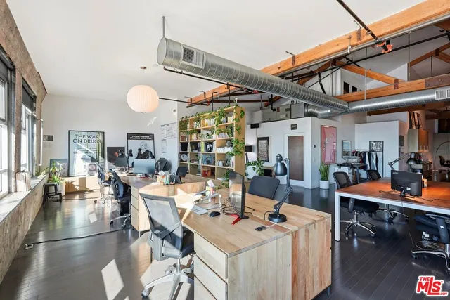 a view of a dining room and livingroom with furniture