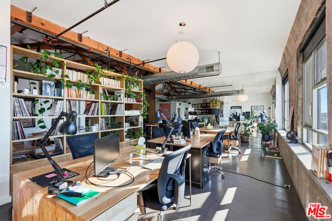 530 South Hewitt Street, Unit 533 Los Angeles, CA 90013 - Photo 25 of 57 a view of a dining room and livingroom with furniture