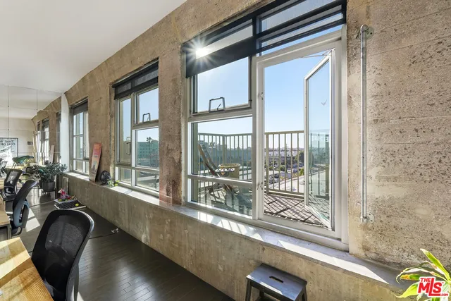 a view of a patio with swimming pool table and chairs