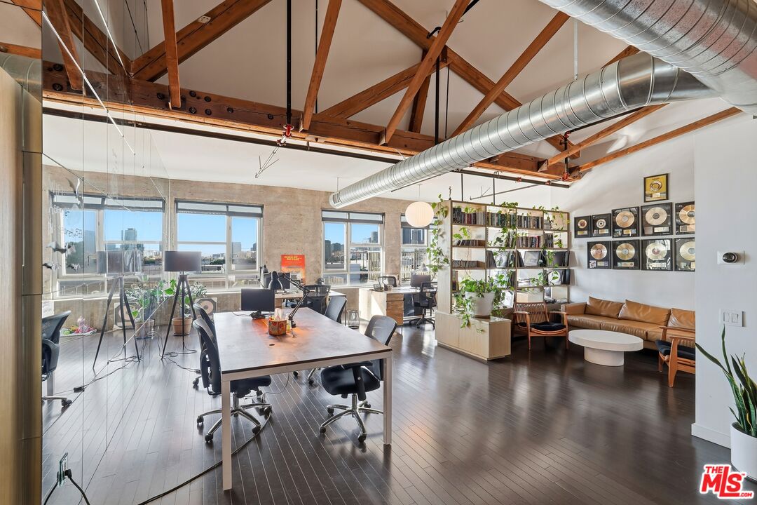 530 South Hewitt Street, Unit 533 Los Angeles, CA 90013 - Photo 30 of 57 a view of a dining room with furniture window and wooden floor