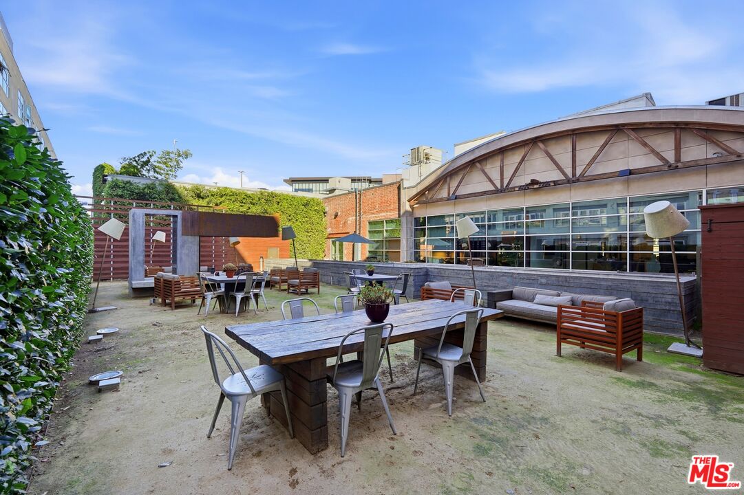 530 South Hewitt Street, Unit 533 Los Angeles, CA 90013 - Photo 42 of 57 a view of a house with backyard and sitting area