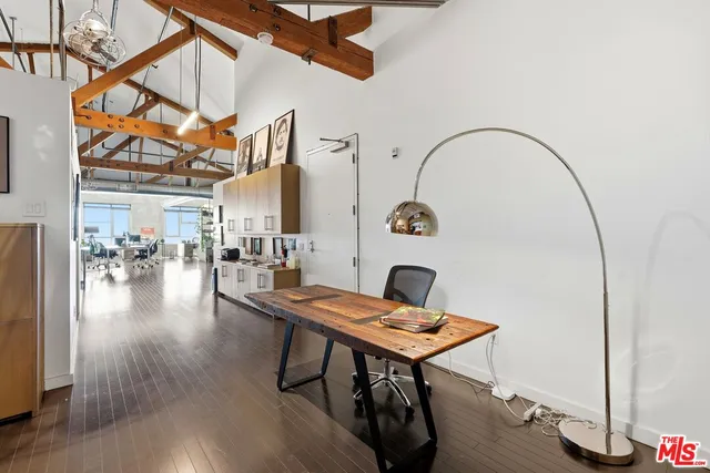 a workspace with furniture and wooden floor
