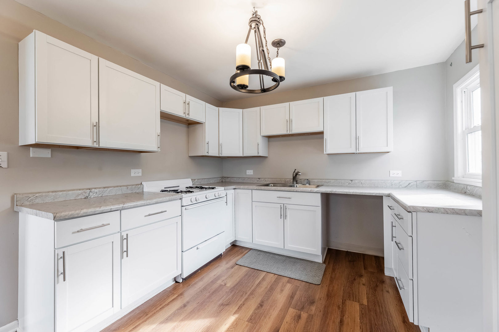 14901 Richmond Avenue Posen, IL 60469 - Photo 8 of 33 a kitchen with stainless steel appliances granite countertop a stove a sink and white cabinets