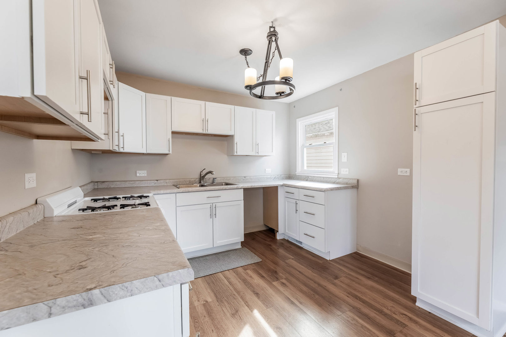 14901 Richmond Avenue Posen, IL 60469 - Photo 9 of 33 a kitchen with white cabinets and window