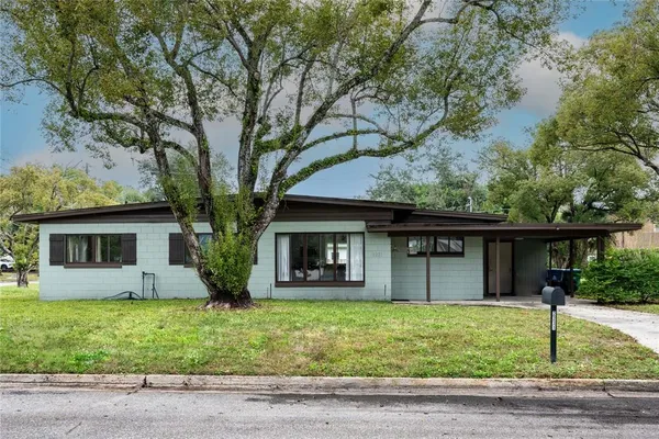 a house with trees in the background