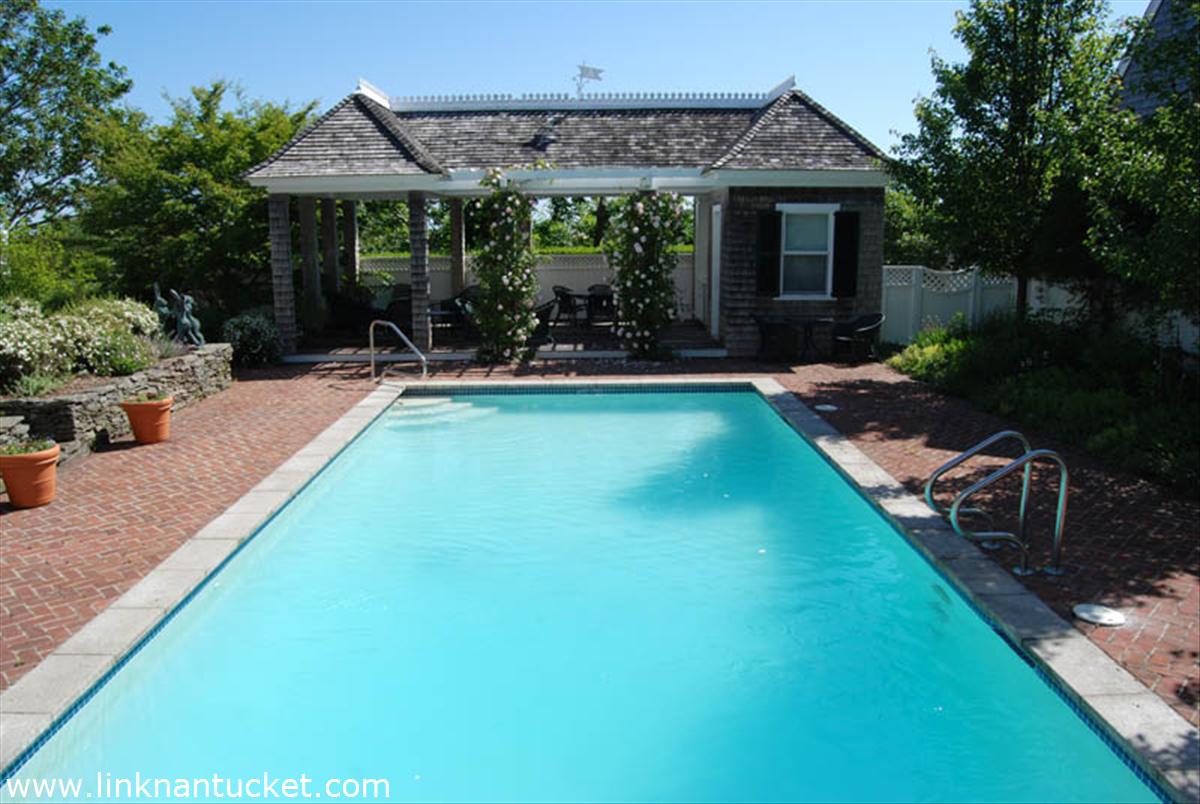 27 Cliff Road Nantucket, MA 02554 - Photo 26 of 32 a view of a house with swimming pool and porch with furniture