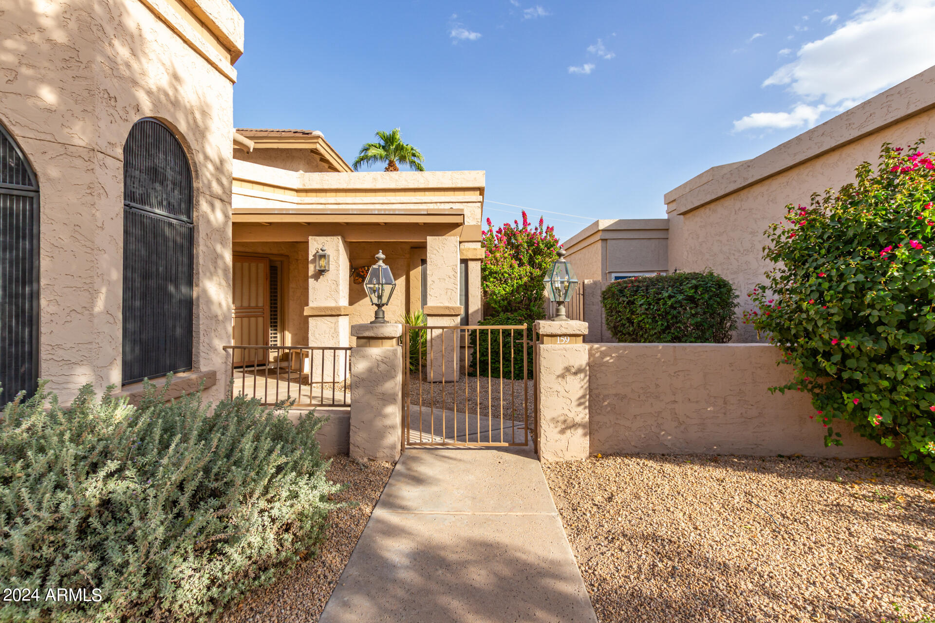 8100 East Camelback Road, Unit 159 Scottsdale, AZ 85251 - Photo 2 of 43 HOA manages front yard maintenance