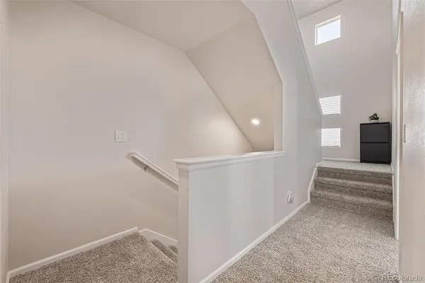 a view of a hallway with staircase