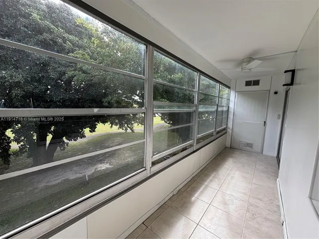 a view of a glass door with a hallway