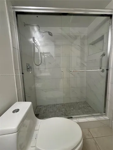 a bathroom with a sink and a shower