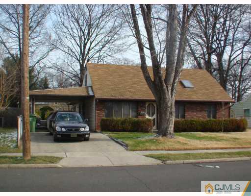 26 Stiles Road Edison, NJ 08817 - Photo 1 of 9 a car parked in front of a house