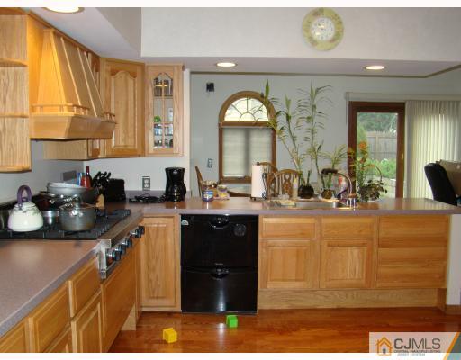 26 Stiles Road Edison, NJ 08817 - Photo 4 of 9 a large bathroom with a sink and a large mirror