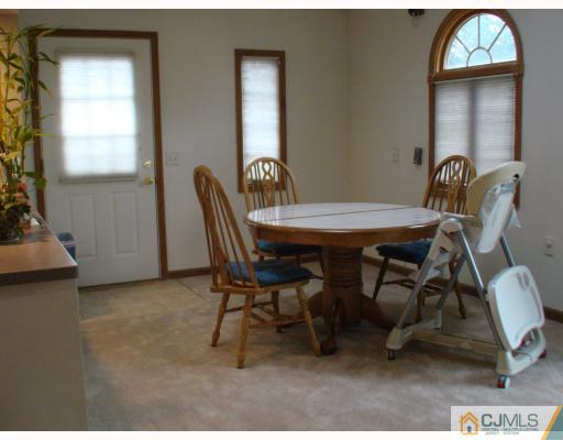 26 Stiles Road Edison, NJ 08817 - Photo 5 of 9 a view of a dining room with furniture and window