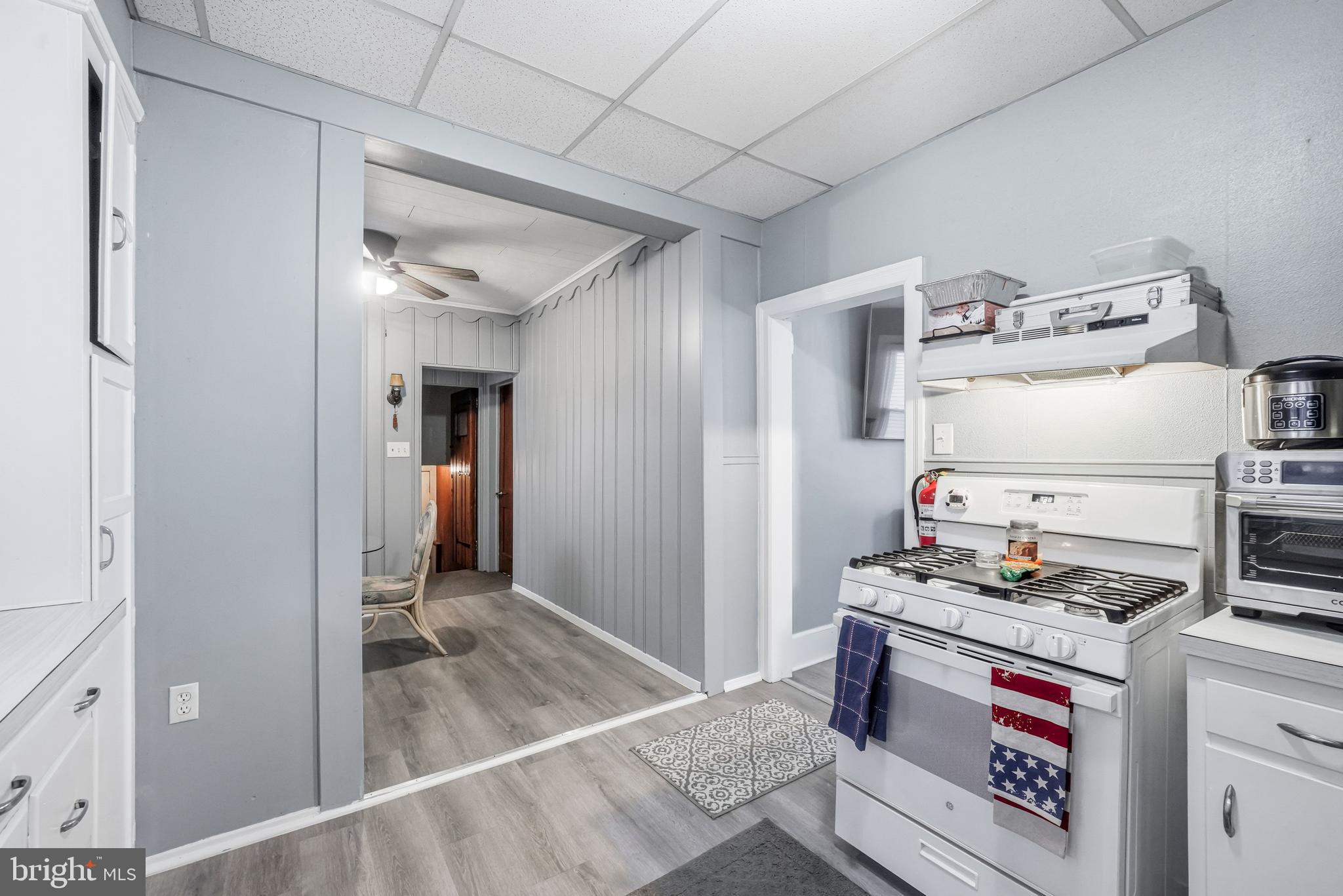 227 Heulings Avenue Riverside, NJ 08075 - Photo 14 of 45 a kitchen with refrigerator and cabinets
