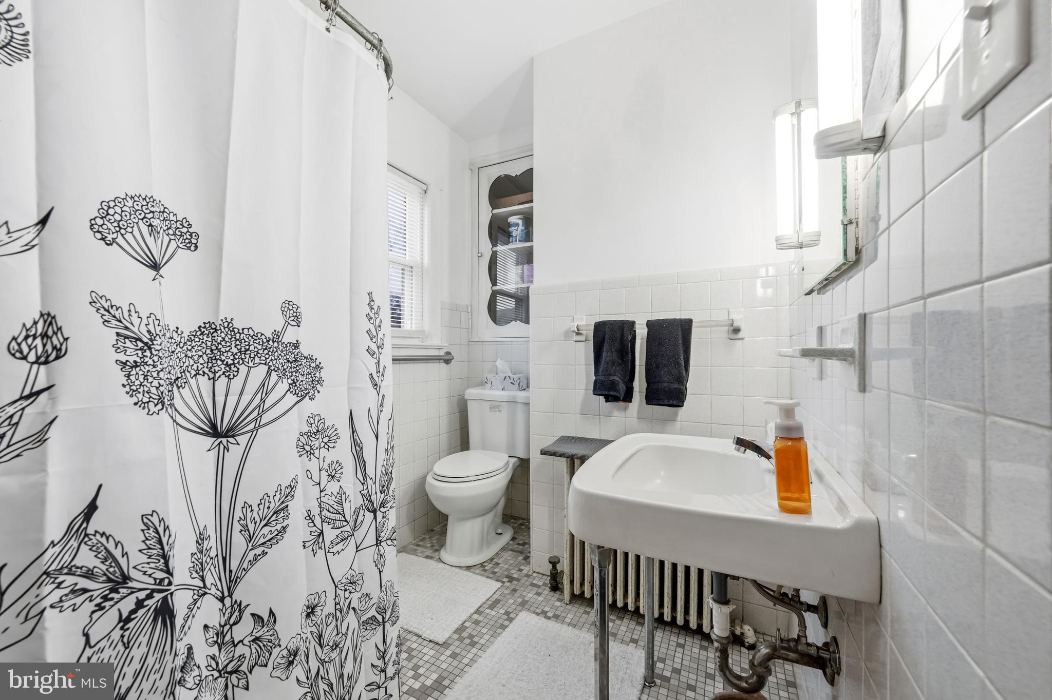 227 Heulings Avenue Riverside, NJ 08075 - Photo 20 of 45 a bathroom with a toilet sink and mirror