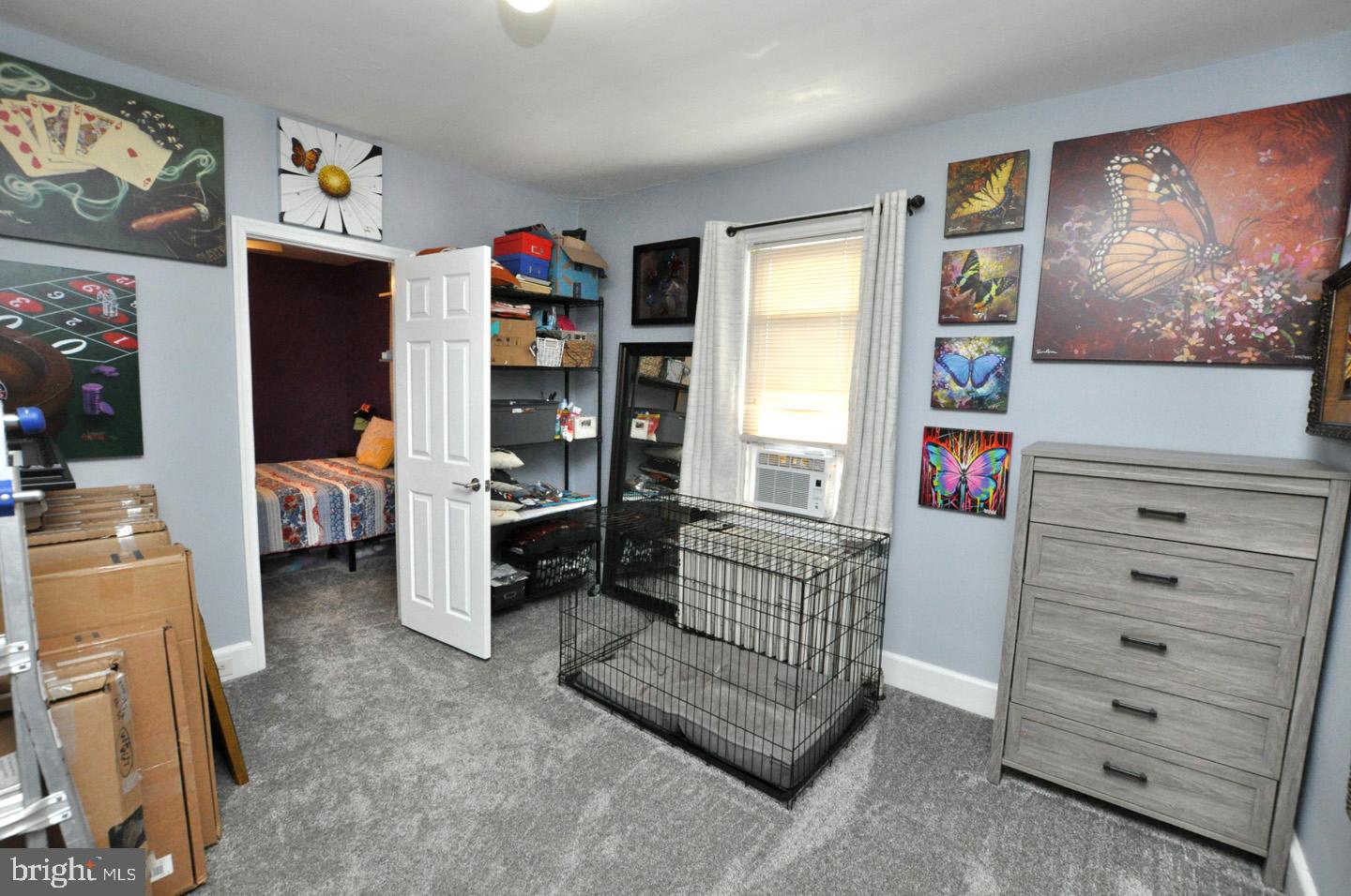 227 Heulings Avenue Riverside, NJ 08075 - Photo 29 of 45 a living room with furniture and baby crib