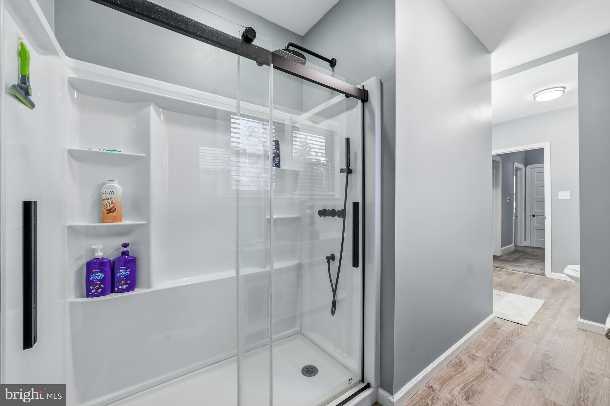 227 Heulings Avenue Riverside, NJ 08075 - Photo 33 of 45 a bathroom with a glass shower door