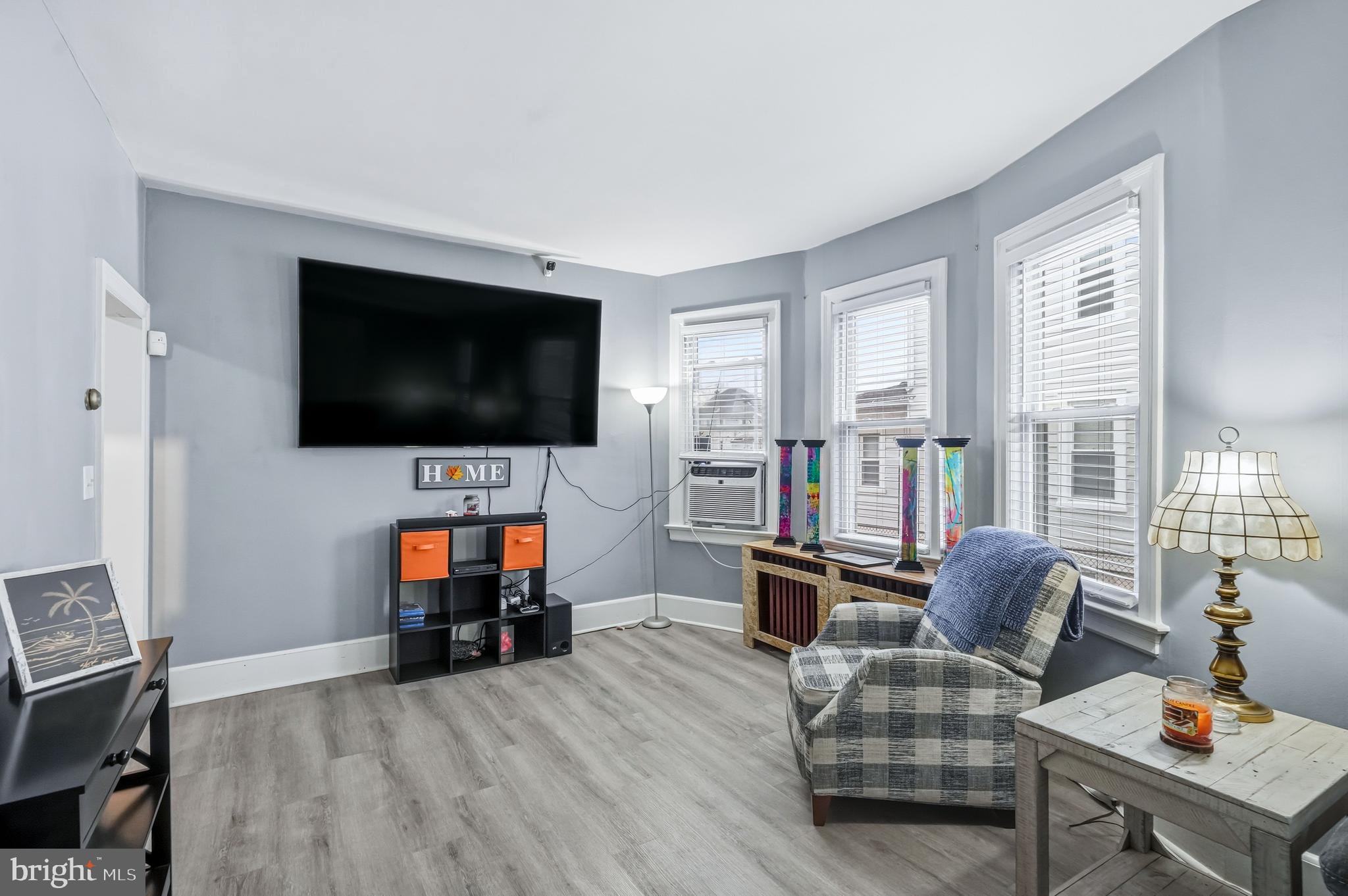 227 Heulings Avenue Riverside, NJ 08075 - Photo 10 of 45 a living room with furniture and a flat screen tv
