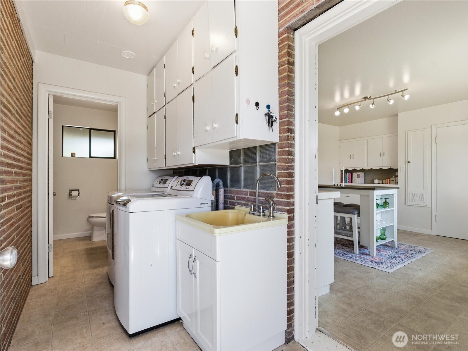 1417 Maple Street Sumner, WA 98390 - Photo 31 of 40 a view of kitchen with sink and refrigerator