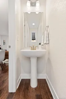 a room with a bed and a painting on wall