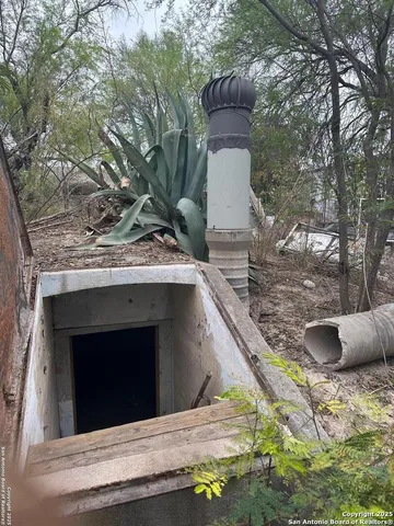 a view of a house with a tree