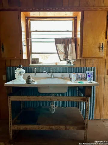 a kitchen with a table and a stove