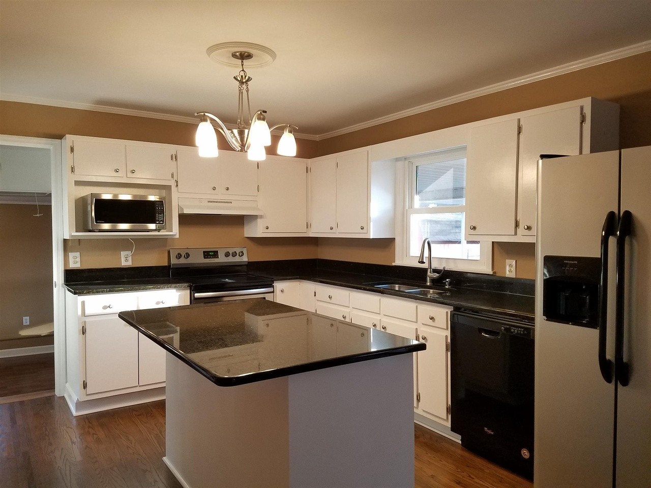 1903 Susan Drive Murfreesboro, TN 37129 - Photo 4 of 11 a kitchen with a sink a stove and microwave