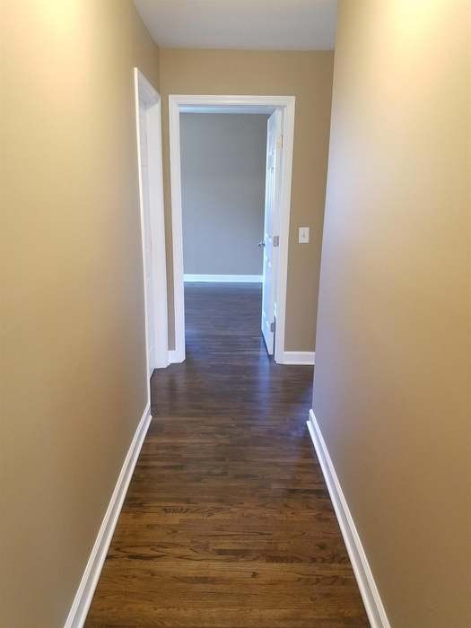 1903 Susan Drive Murfreesboro, TN 37129 - Photo 7 of 11 a view of a hallway with wooden floor