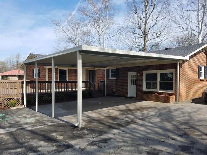 1903 Susan Drive Murfreesboro, TN 37129 - Photo 10 of 11 a view of a house with a large window and wooden fence