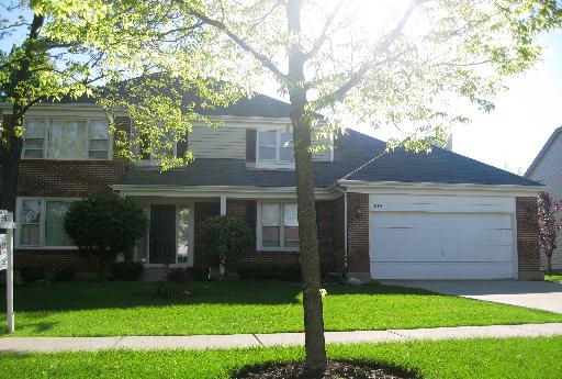 619 Raintree Road Buffalo Grove, IL 60089 - Photo 1 of 1 a front view of a house with a garden and yard